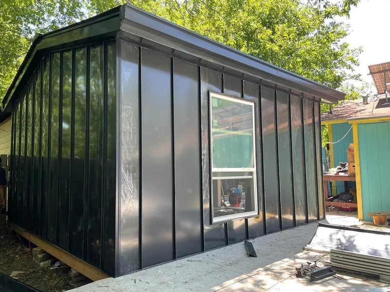 Black standing seam metal wall panels for Roof Inspection in Louisburg