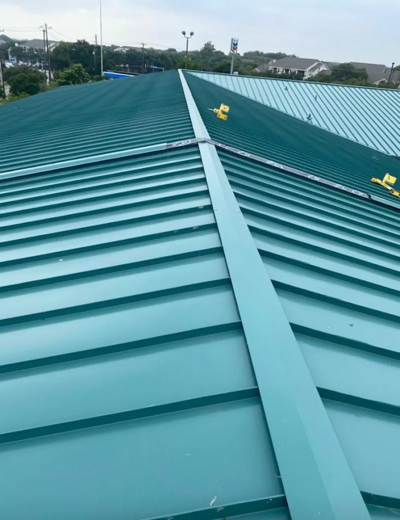 Green commercial metal roof ridge and valley for Metal Roof Repair in Louisburg