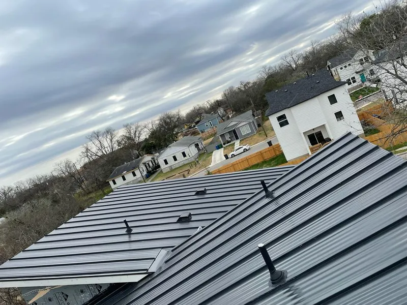 Standing seam metal roof panels with vents for Skylight Repair in Louisburg